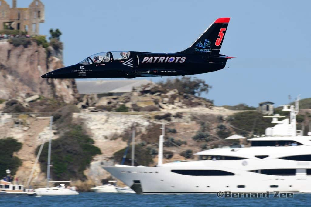 Scott Kartvedt in a Patriots fighter jet team flying very low over the harbor