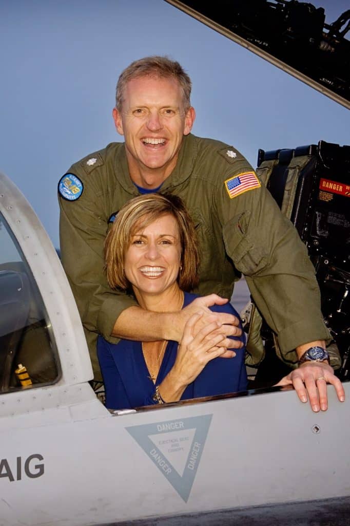 Scott and his wife in a jet cockpit